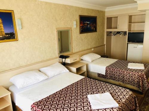 Foto de una habitación de Hamit Hotel