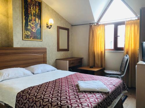 Foto de una habitación de Hamit Hotel