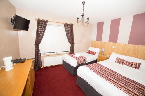 Foto de una habitación de The Frontier Hotel