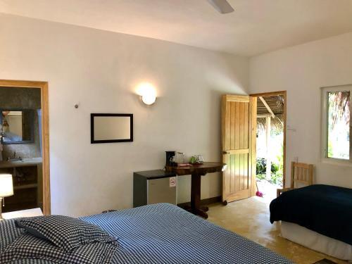 Foto de una habitación de Junto al Rio Bungalows &amp;amp; Suites