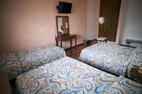 Foto de una habitación de Hotel Maria De Lourdes