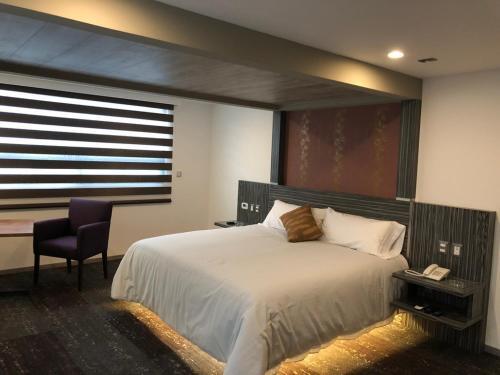 Foto de una habitación de Kaia Suites