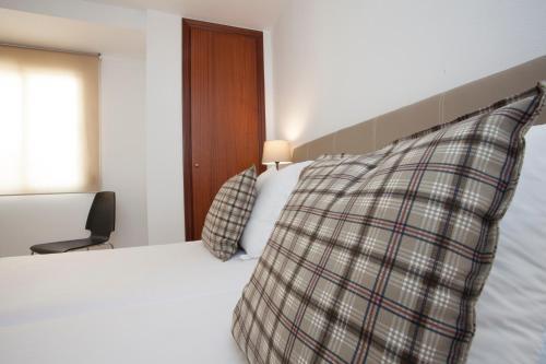 Foto de una habitación de Apartamentos SingularStays Mercado Central