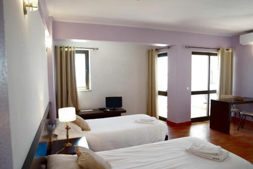 Foto de una habitación de Apartamentos Via Dona Ana
