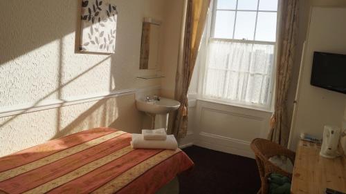 Foto de una habitación de Hampton Court Guesthouse