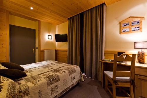 Foto de una habitación de Logis Hotel &amp;amp; Spa Beau-Site
