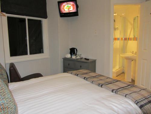 Foto de una habitación de Monties Guest House