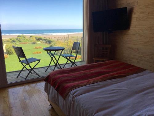 Foto de una habitación de Lodge del Mar