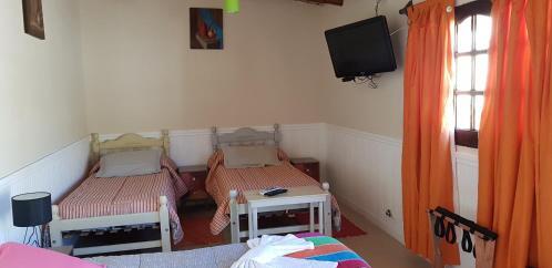 Foto de una habitación de Asqui Pacha Hostel