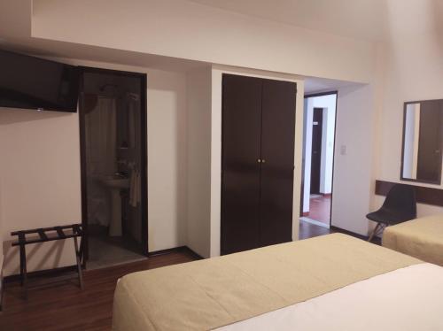 Foto de una habitación de EMILIA HOTEL