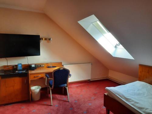 Foto de una habitación de AVALON Hotelpark Königshof