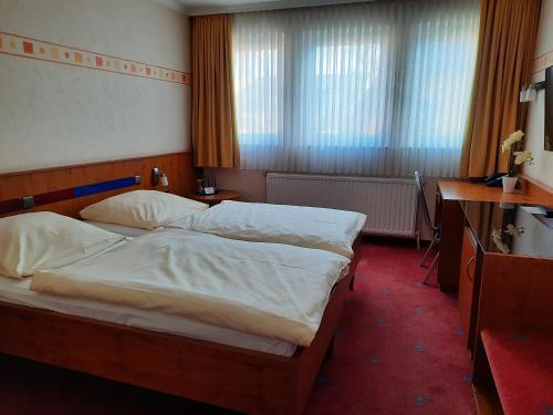 Foto de una habitación de AVALON Hotelpark Königshof
