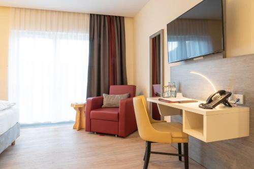 Foto de una habitación de Hotel Mythenresort Heimdall