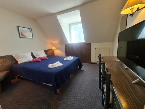 Foto de una habitación de Hôtel Le Montaigu