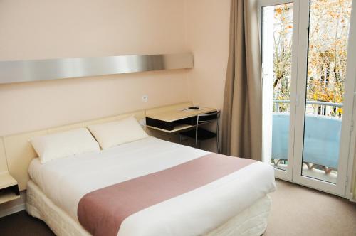 Foto de una habitación de Hôtel Mondial