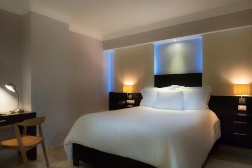 Foto de una habitación de Hotel Plaza Florida Suites