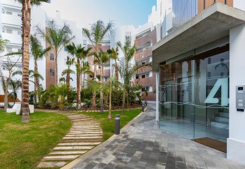 Foto de una habitación de Apartamentos Homity Exclusive Playa Granada Beach &amp;amp; Golf - Mar de Astrid