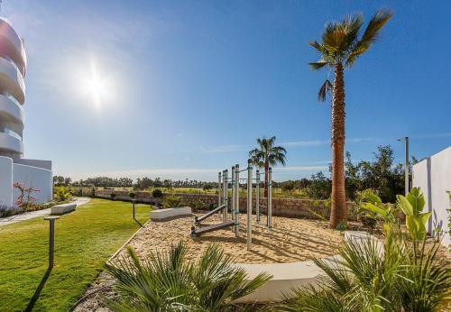 Foto de una habitación de Apartamentos Homity Exclusive Playa Granada Beach &amp;amp; Golf - Mar de Astrid