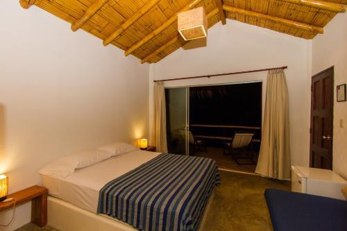 Foto de una habitación de Hoja de Palma Bungalows