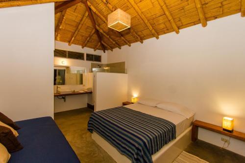 Foto de una habitación de Hoja de Palma Bungalows
