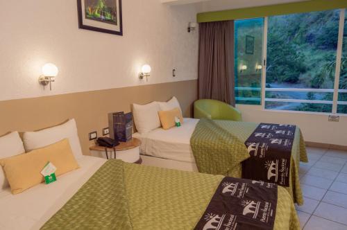 Foto de una habitación de Hotel Puente Nacional &amp;amp; Spa