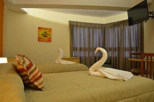 Foto de una habitación de AVEMAR Apart Hotel