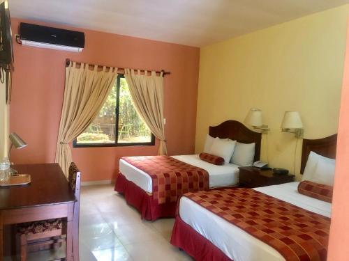 Foto de una habitación de Hotel Plaza Maria