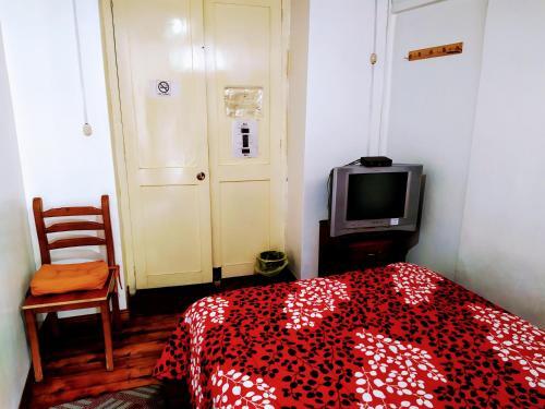 Foto de una habitación de Hostal Latitud Ecuem
