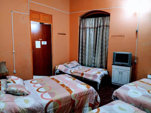 Foto de una habitación de Hostal Latitud Ecuem