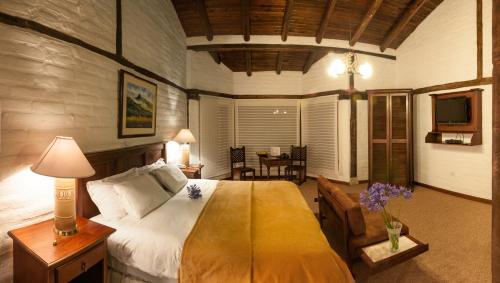 Foto de una habitación de Hotel Hacienda Abraspungo