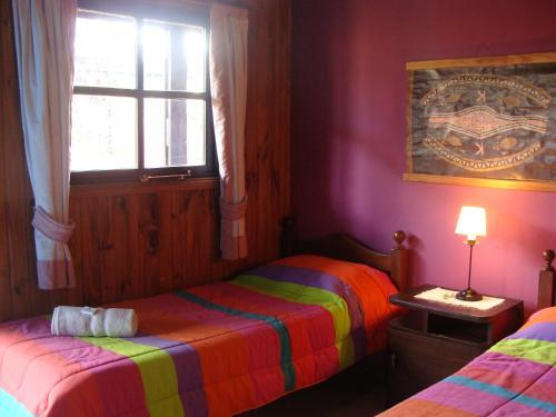 Foto de una habitación de Lago Argentino Hostel