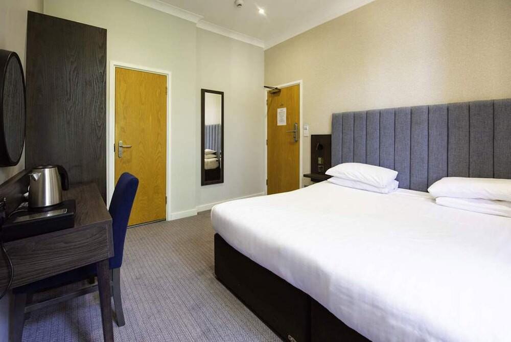 Foto de una habitación de Garden Court Hotel