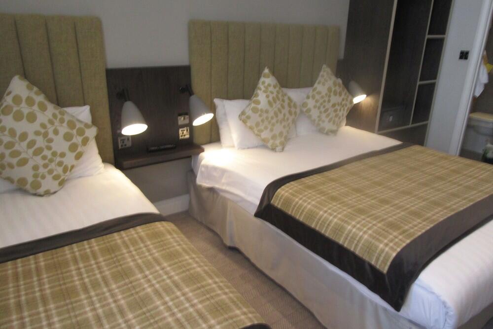 Foto de una habitación de Garden Court Hotel