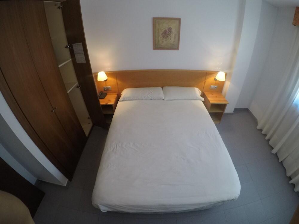Foto de una habitación de Apartamentos Turísticos Roc Del Castell