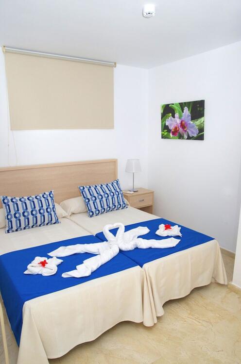 Foto de una habitación de Apartamentos La Cataleya