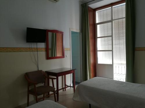 Foto de una habitación de Nuevo Hotel