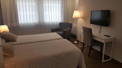 Foto de una habitación de Apartamentos Centro Colón