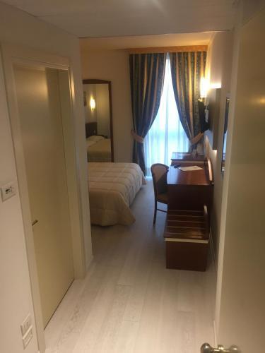 Foto de una habitación de Noventa Hotel