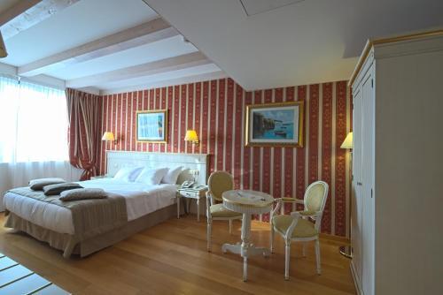 Foto de una habitación de Noventa Hotel
