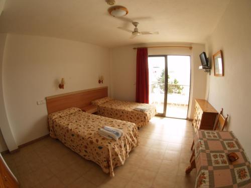 Foto de una habitación de Apartamentos Mar Bella