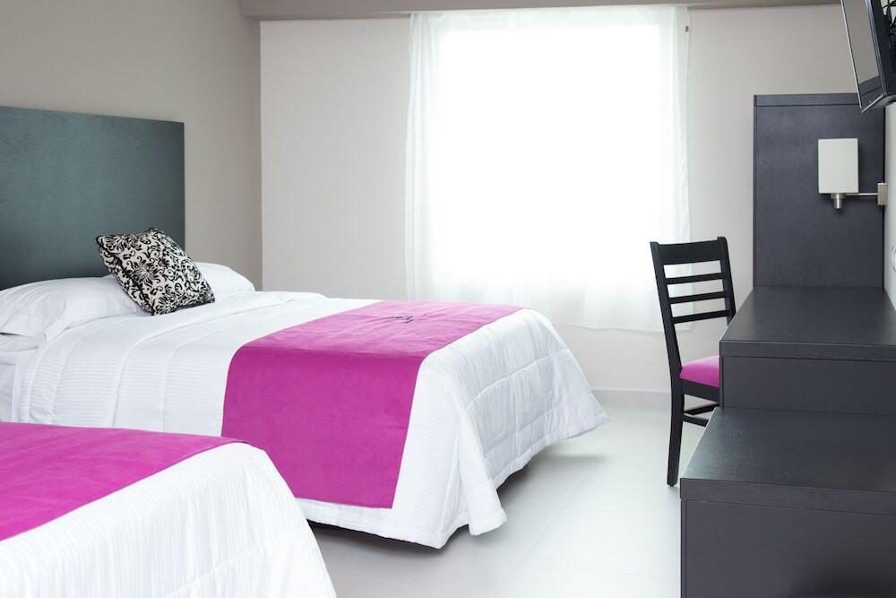 Foto de una habitación de Hoteles HAUS