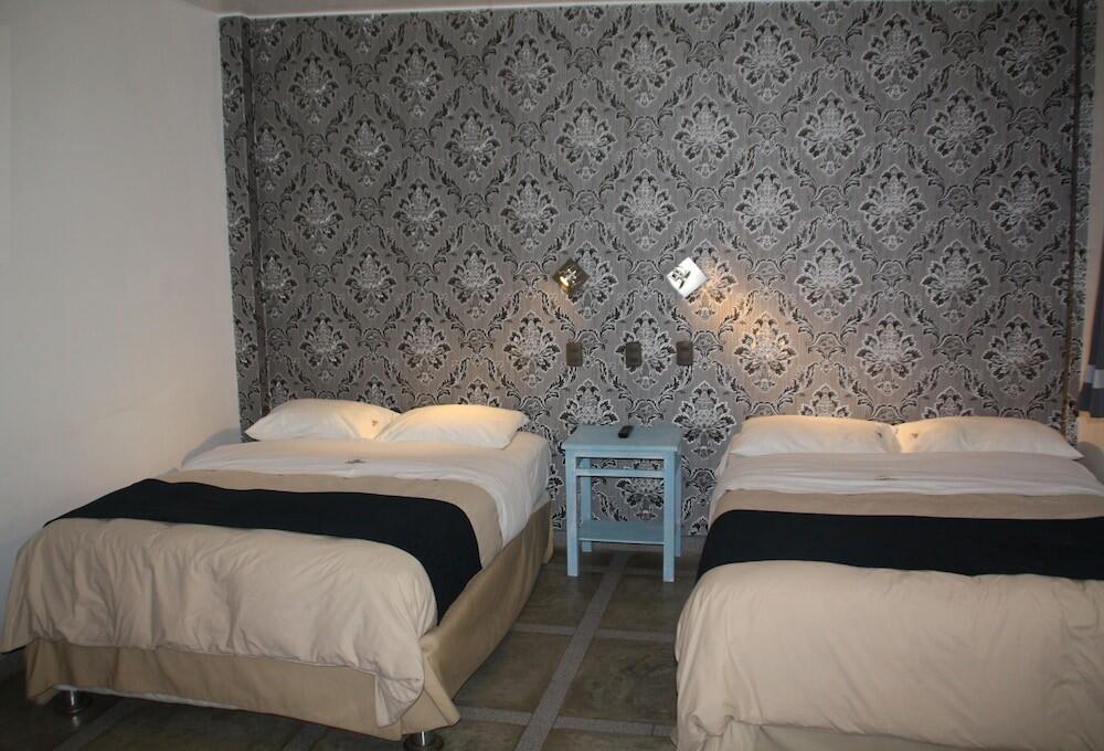 Foto de una habitación de Hotel Villa Jazmin