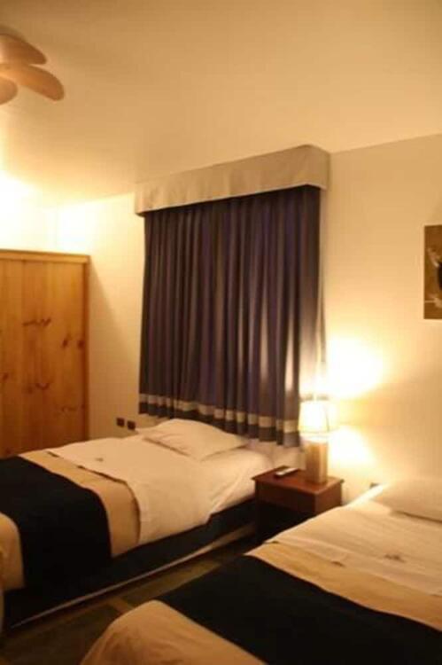 Foto de una habitación de Hotel Villa Jazmin