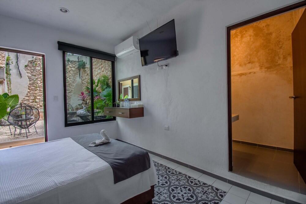 Foto de una habitación de Hotel Colonial Zaci by GuruHotel
