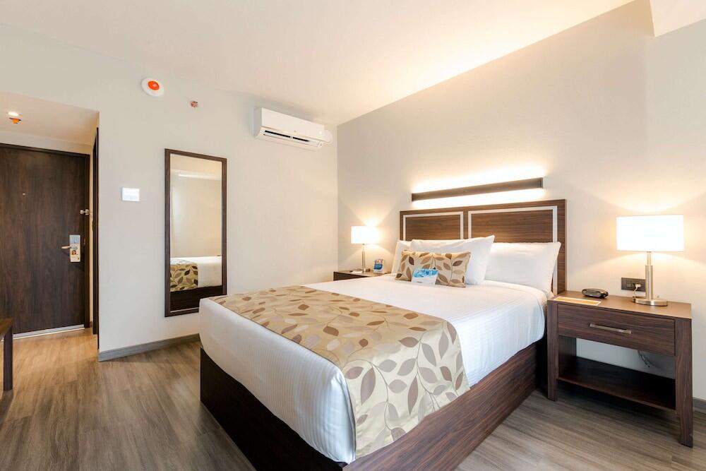 Foto de una habitación de Hotel Sleep Inn Guadalajara Galerías