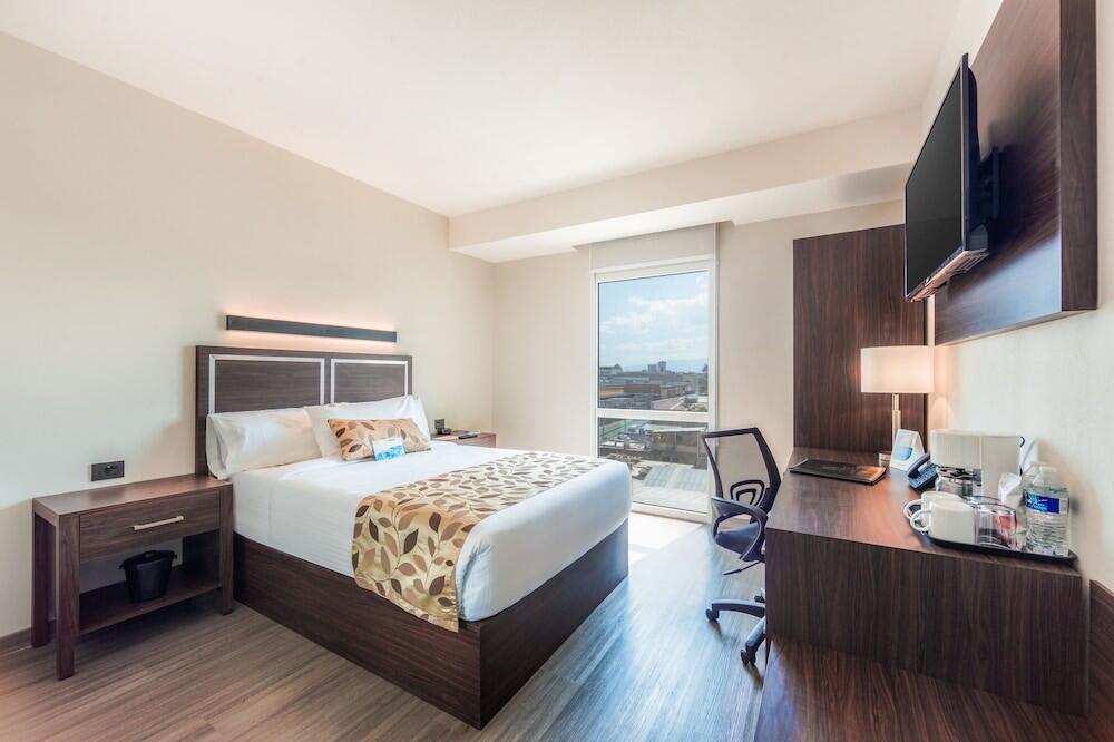 Foto de una habitación de Hotel Sleep Inn Guadalajara Galerías