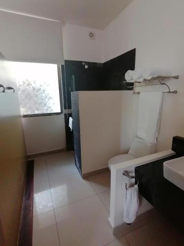 Foto del baño de Amoe Hotel Boutique &amp;amp; Spa