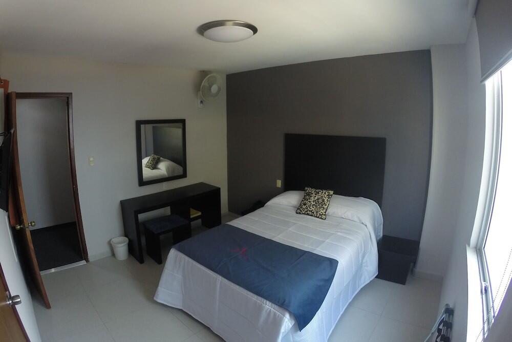 Foto de una habitación de Hotel HAUS Express