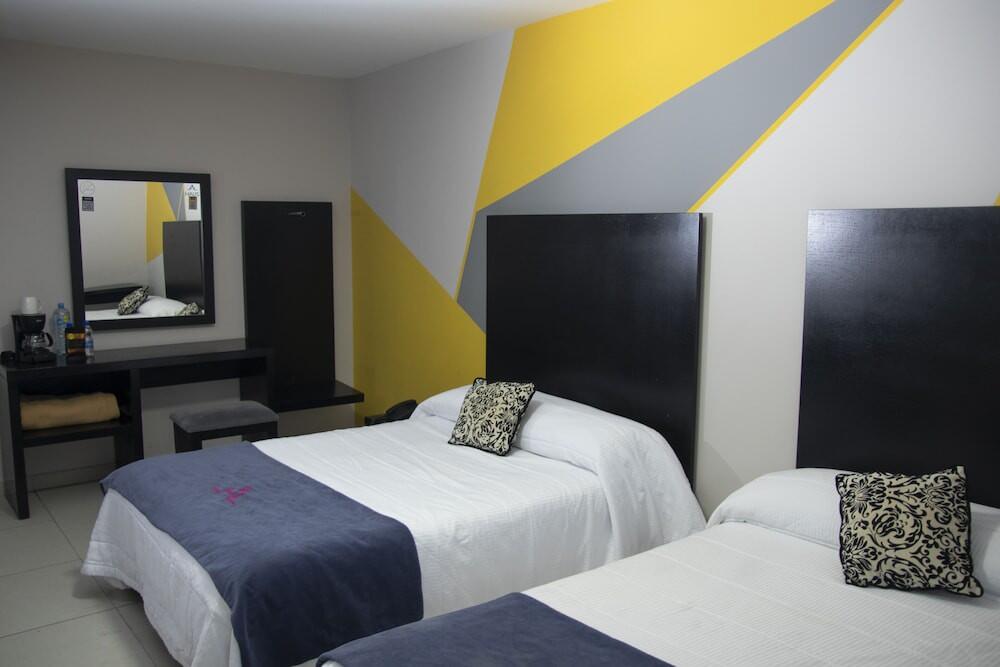 Foto de una habitación de Hotel HAUS Express