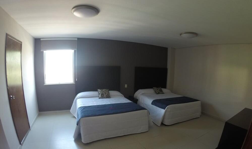 Foto de una habitación de Hotel HAUS Express